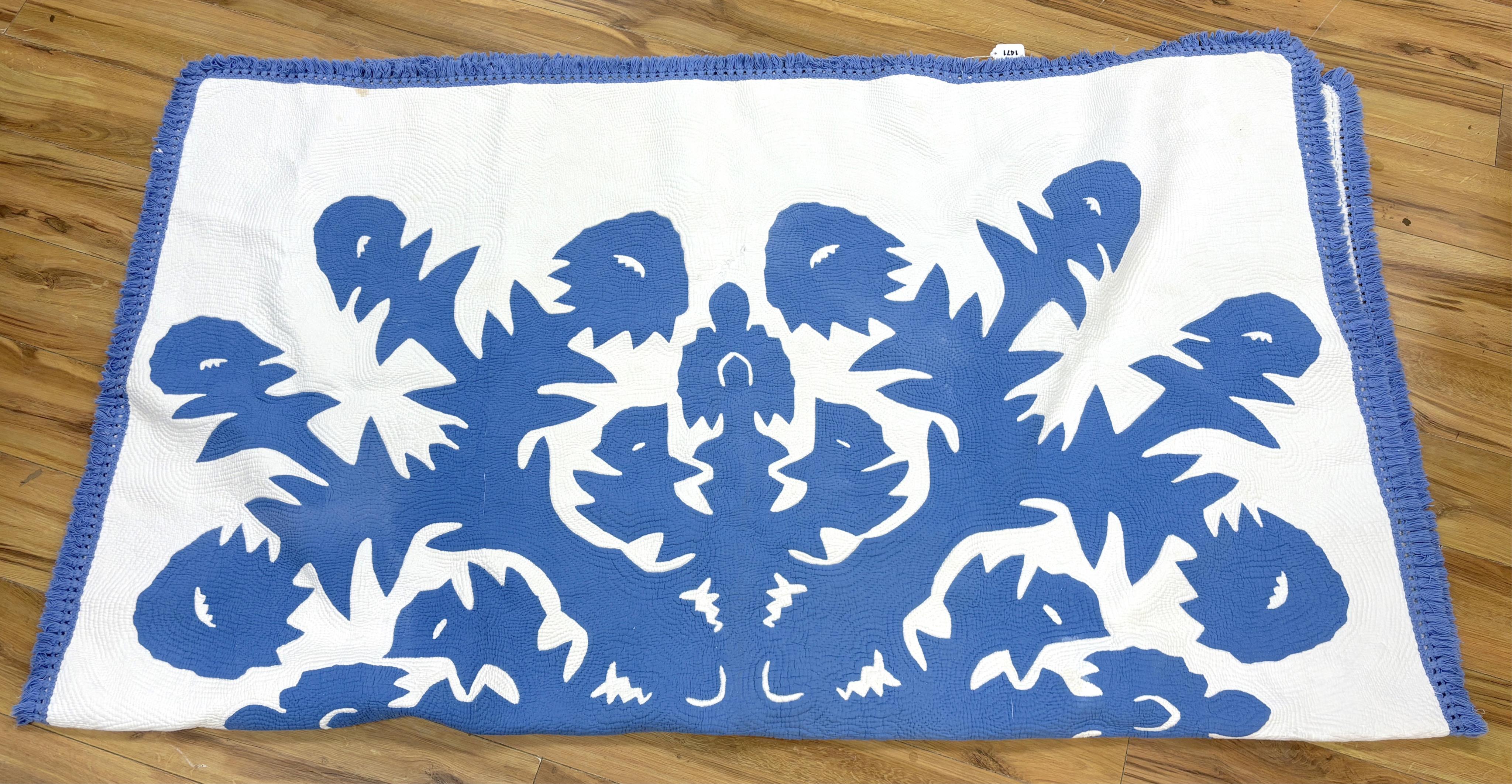 An American blue and white fringed bedcover (quilt)